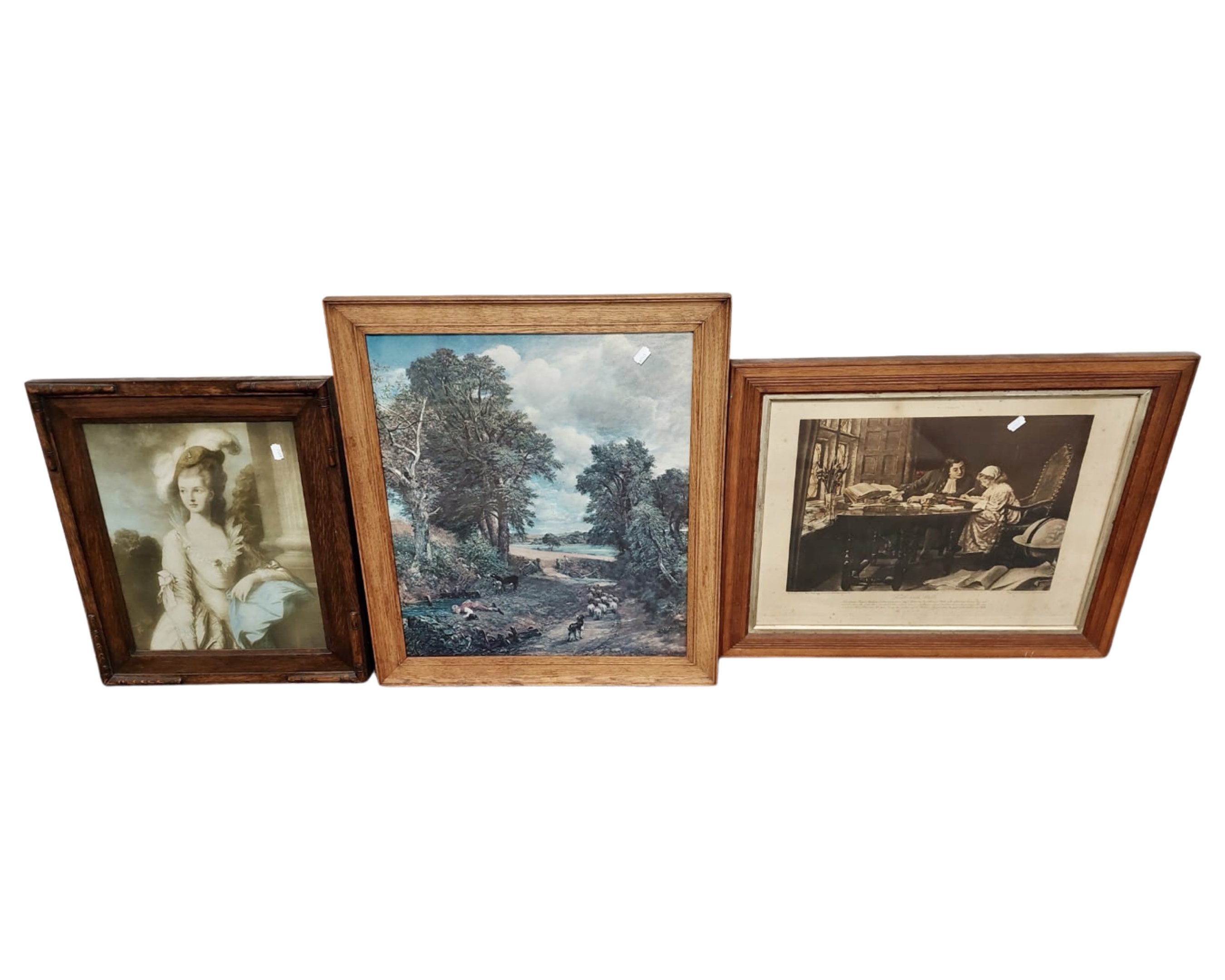 An Edwardian oak framed print depicting a lady together with two further prints.