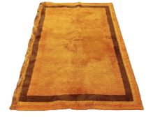 A 1970s orange woolen rug, 197cm by 135cm.