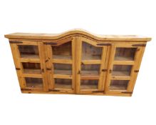 A pine four door dome topped bookcase top.