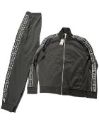 A Givenchy two-piece tracksuit, black with white detailing, size medium.