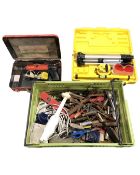 A plastic crate containing assorted hand tools and spirit level together with a boxed laser level