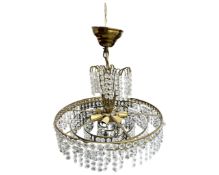 A Continental gilt brass chandelier with glass drops