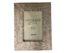 One crate containing twenty Xenos Fotolijst silvered finish 10 cm x 15 cm photo frames,