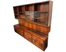 A mid century Danish rosewood twin section bookcase fitted with cupboards,