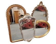 Four gilt and silvered framed mirrors, various sizes.