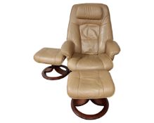 A tan leather upholstered swivel relaxer chair together with two matching footstools.