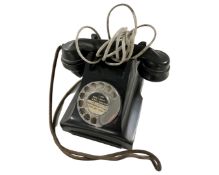 An antique bakelite telephone