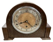 An Art Deco oak mantel clock.