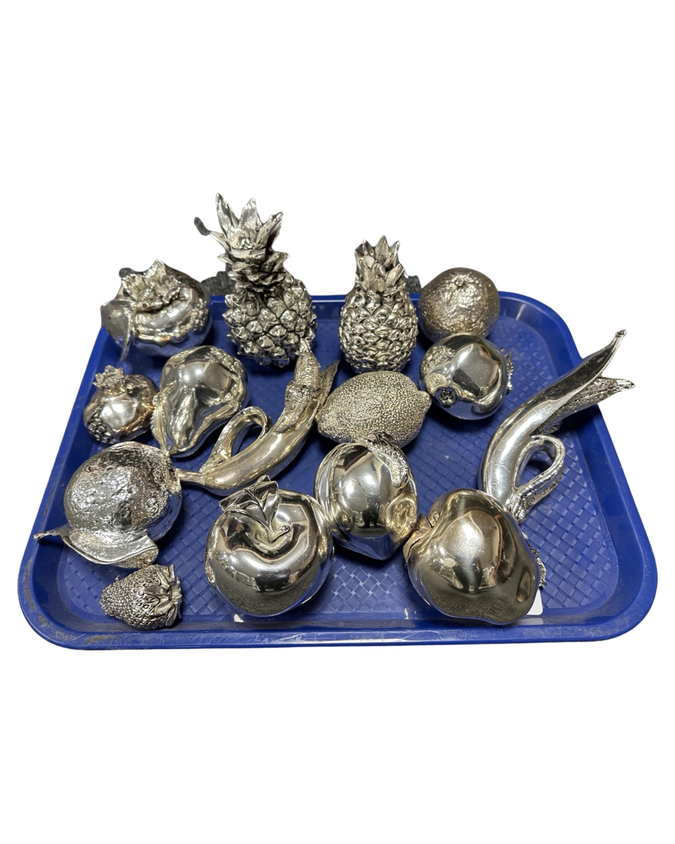 A collection of 15 continental metallic coated fruit ornaments.
