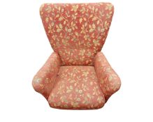 A late 20th century Scandinavian armchair in floral upholstery.