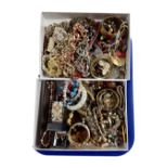 Two boxes containing a quantity of assorted costume jewellery.