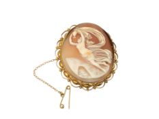 An ornate gold cameo brooch with gold safety chain