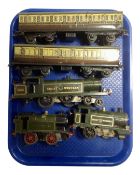A tray containing Hornby Tri-ang tin plate Great Western engines, together with two Pullman coaches.