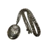 An antique silver locket on chain CONDITION REPORT: 37.