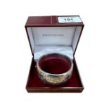 An engraved silver bangle in Walker & Hall box.