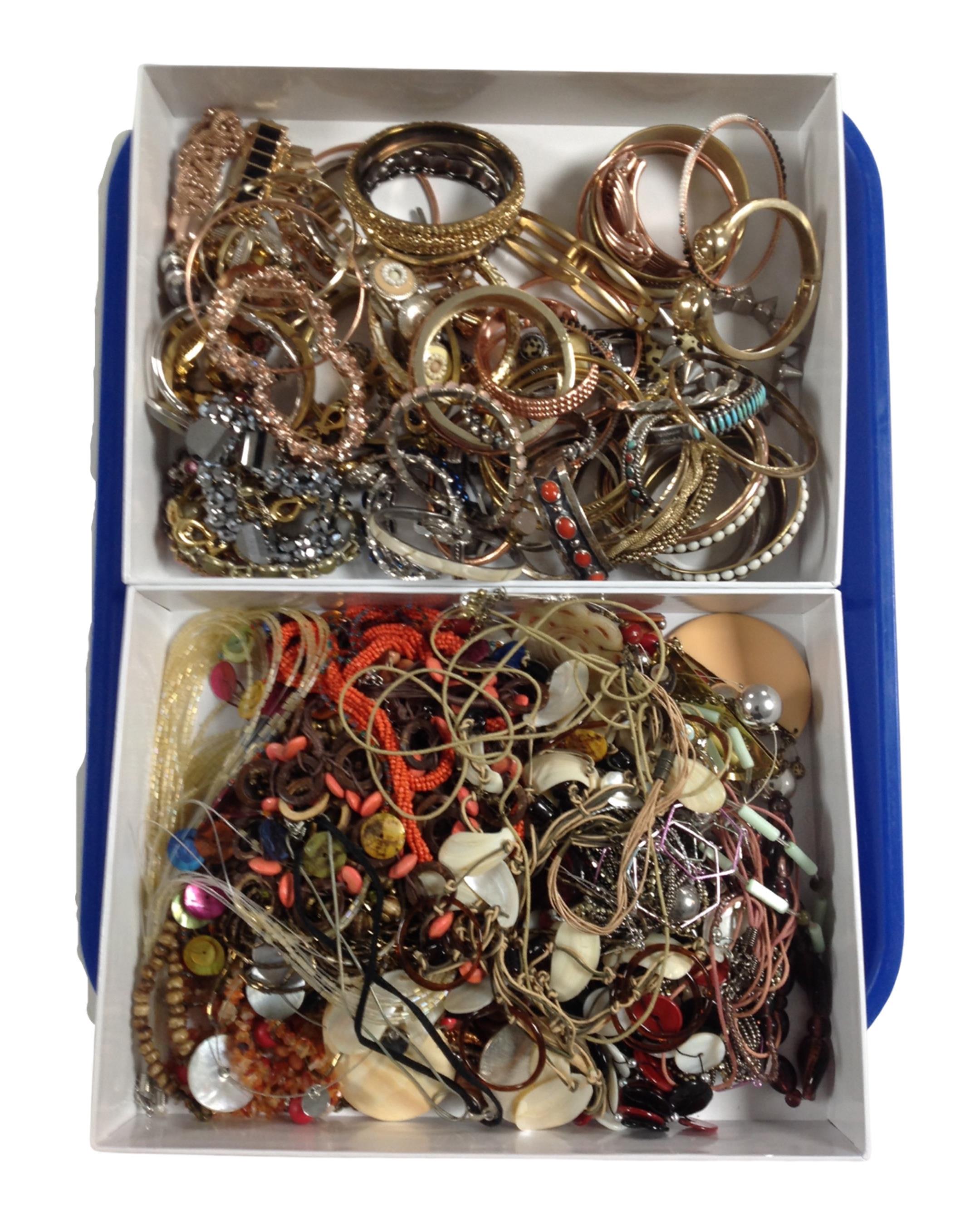 Two boxes containing a quantity of assorted costume jewellery.