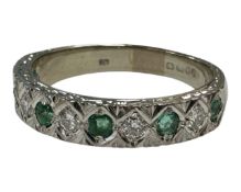 An 18ct white gold emerald and diamond half-eternity ring, size P, 5.2g.