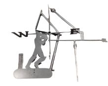 A cast metal weather vane surmounted by a cricketer.