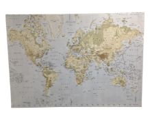 An oversized wall canvas map of the world.
