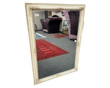 A painted pine bevelled mirror, 72cm by 103cm.