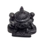 A 19th century cast metal miniature inkwell.