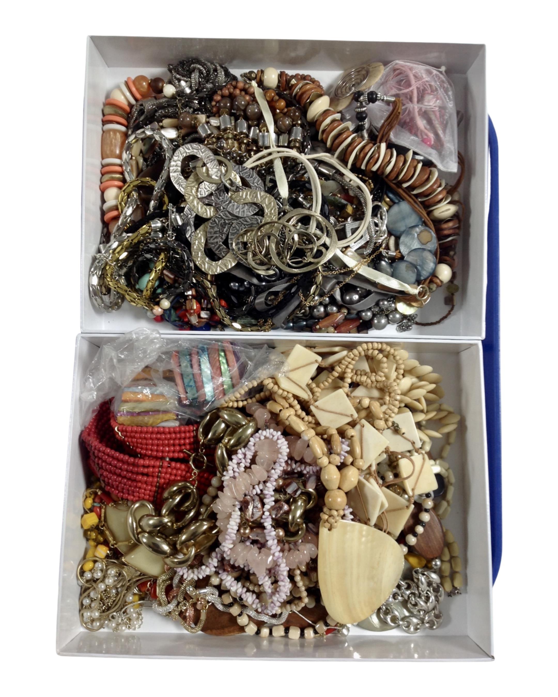 Two boxes containing a quantity of assorted costume jewellery.