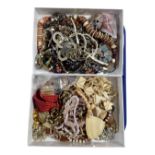 Two boxes containing a quantity of assorted costume jewellery.