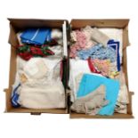 Two boxes containing a quantity of table linens.