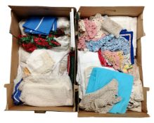 Two boxes containing a quantity of table linens.