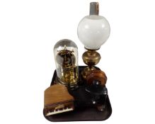 A brass oil lamp with chimney and opaque glass shade together with a 19th century cast iron