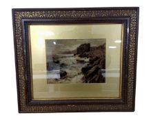 An antiquarian print on glass depicting a rocky coastline, in frame and mount, 25cm by 19cm.