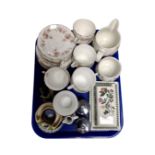 A tray containing Duchess June Bouquet tea china, Portmeirion Botanic Gardens milk jug,