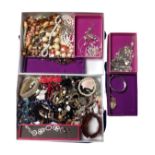 Two boxes containing a large quantity of assorted costume jewellery.