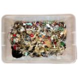 A plastic box containing a large quantity of assorted costume jewellery.