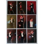 A collection of professional photographs taken of Michael Jackson on stage in 1992 performing his