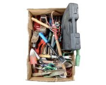 A box containing a collection of assorted hand tools, garden tools, a cased soldering kit,