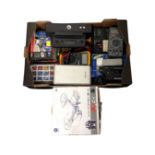 A box containing a remote control quad copter (boxed), digital meters, a portable power station,