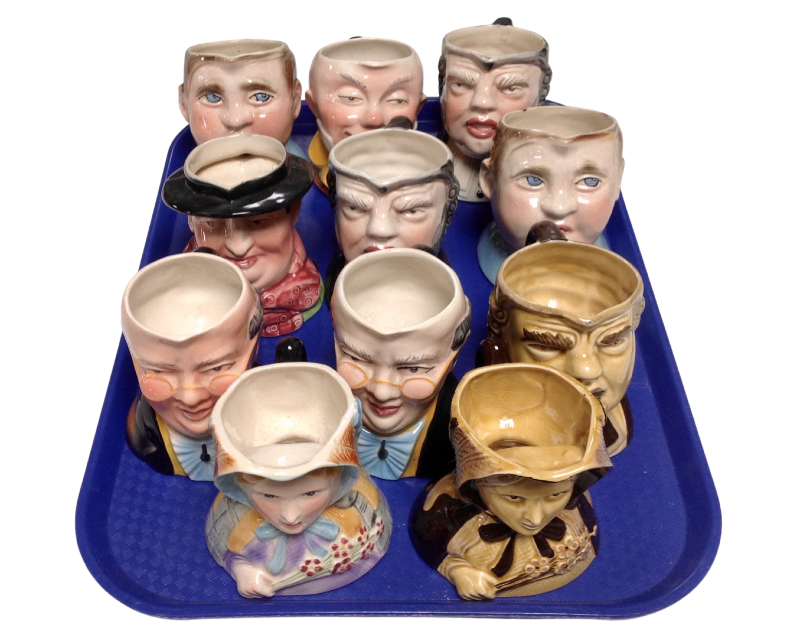 A tray containing 11 Avon Ware Dickens character jugs.