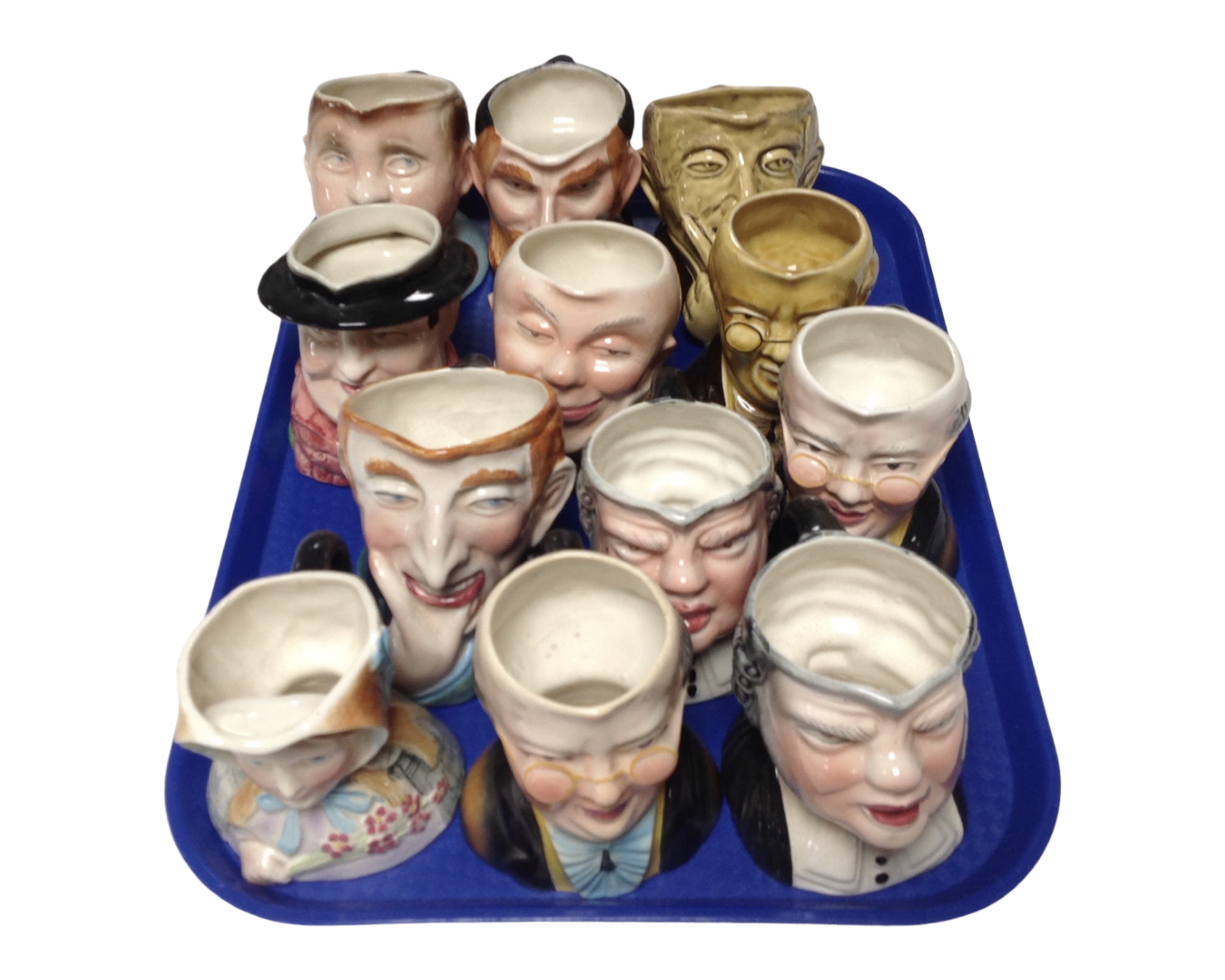 A tray containing 12 Avon Ware Dickens character jugs.