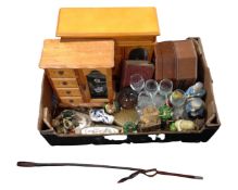 A box containing dressing table pieces, jewellery boxes and chests, two leather riding crops,