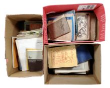 Three boxes containing sheet music and music books.