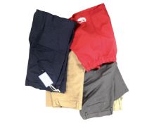 A box containing three pairs of Dockers trousers (one tagged),