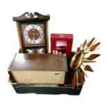 A box containing a valve radio, contemporary eight day wall clock, sunburst clock,