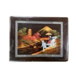 A 20th century Chinese lacquered photo album containing monochrome photographs including scenes of