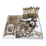 A tray containing metalware including white metal embossed plaques, lead animal figures,