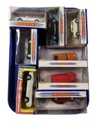 A tray containing eight boxed Dinky die cast vehicles.