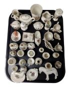 A tray containing a collection of crested china.