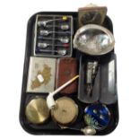 A tray containing a mid-20th century West Clock alarm clock, compacts, a clay pipe,