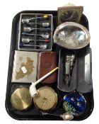 A tray containing a mid-20th century West Clock alarm clock, compacts, a clay pipe,