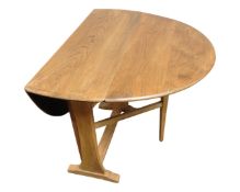 An Ercol elm and beech drop leaf table